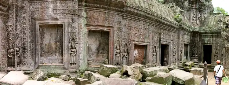 A wall lined with Ta Prohm Devatas